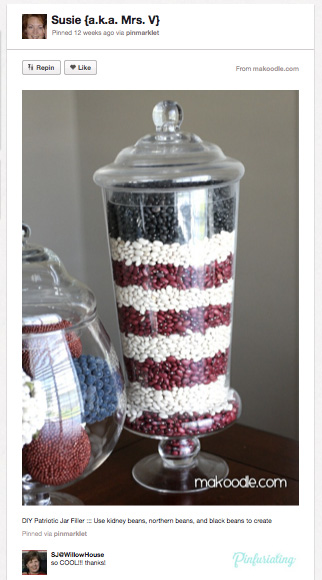 An image of red, white and blue beans arranged in a tall vase to resemble the American flag.